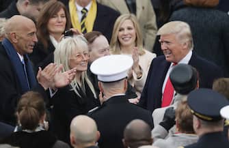 WASHINGTON, DC - JANUARY 20:  (L-R) Tom Barrack, Miriam Adelson and Sheldon Adelson greet U.S. President-elect Donald Trump on the West Front of the U.S. Capitol on January 20, 2017 in Washington, DC. In today's inauguration ceremony Donald J. Trump becomes the 45th president of the United States.  (Photo by Chip Somodevilla/Getty Images)