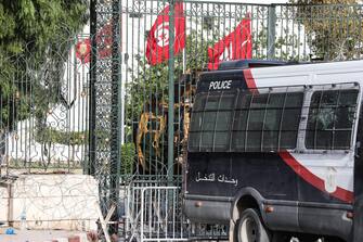 epa09371557 Police cars and a military armored personnel carrier block a side entrance of the Tunisian parliament in Tunis, Tunisia, 27 July 2021. The Ennahda party has called for dialogue following President Saeid's sacking of the prime minister Mechichi and suspension of parliament on 25 July.  EPA/STRINGER