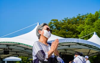 A woman prays at Peace Memorial Park, as Hiroshima marks the 76th anniversary of the atomic bombing. The atomic bombing which killed about 150,000 people and destroyed the entire city for the first bombing with a nuclear weapon in a war. (Photo by Jinhee Lee / SOPA Images/Sipa USA)