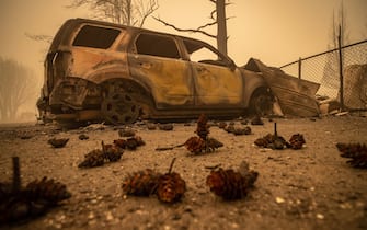 epa09404933 Buildings and vehicles are left destroyed by the Dixie Fire in Greenville, California, USA, 07 August 2021. The Dixie Fire had grown to over 440,000 acres as of 07 August.  EPA/CHRISTIAN MONTERROSA
