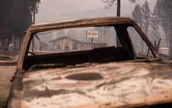 GREENVILLE, CA - AUGUST 08: A burned vehicle destroyed by the Dixie Fire lies parked near Highway 89 on August 8, 2021 in Greenville, California. The Dixie Fire, which has incinerated more than 463,000 acres, is the second largest recorded wildfire in state history and remains only 21 percent contained. (Photo by David Odisho/Getty Images)