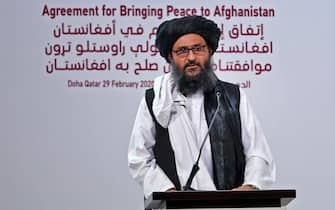 Taliban co-founder Mullah Abdul Ghani Baradar speaks at a signing ceremony of the US-Taliban agreement in the Qatari capital Doha on February 29, 2020. - The United States is to sign a landmark deal with the Taliban, laying out a timetable for a full troop withdrawal from Afghanistan within 14 months as it seeks an exit from its longest-ever war. (Photo by KARIM JAAFAR / AFP) (Photo by KARIM JAAFAR/AFP via Getty Images)