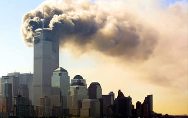 FKM16 - 20010911 - NEW YORK, UNITED STATES : Balls of flames and smoke billow out of the top floors of the World Trade Center Towers 11 September 2001 in New York City.  Witnesses say two separate planes flew into the towers, in what is suspected to be a terrorist attack. EPA PHOTO DPA/HUBERT MICHAEL BOESL/tm-ms