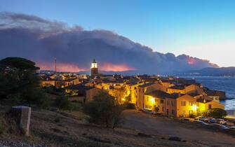 Smoke rises from a massive wildfire in Gonfaron, seen from the heighys of Saint Tropez, south of France on August 16, 2021. Hundreds of firefighters battle a wildfire that broke out in the Var region of southern France, Interior Minister Gerald Darmanin said on Monday. Much of the Mediterranean region has faced bouts of extremely hot weather in recent weeks but southern France had hitherto escaped any big blazes. Multiple water-bombing aircraft were also involved in the operation to contain the fire that has already burned several hundred hectares, local authorities said. Photo by ABACAPRESS.COM