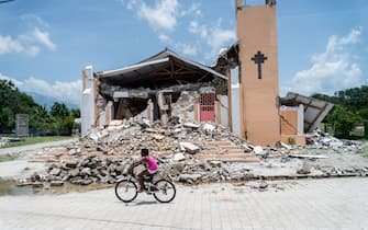 The Church St Anne is seen completely destroyed by the earthquake in Chardonnieres, Haiti on August 18, 2021. - The death toll from a 7.2 magnitude earthquake that struck Haiti has risen to 1,941, the Caribbean nation's civil protection agency said Tuesday, as a tropical storm brought torrential downpours on survivors already coping with catastrophe.
More than 9,900 people were wounded when the quake struck the southwestern part of the Caribbean nation on Saturday, about 100 miles (160 kilometers) to the west of the capital Port-au-Prince, according to the updated toll. (Photo by Reginald LOUISSAINT JR / AFP) (Photo by REGINALD LOUISSAINT JR/AFP via Getty Images)