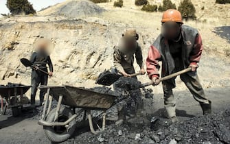 epa02233257 A picture made available on 02 July 2010 shows Afghan men working at a coal-mine in Herat province western Afghanistan on 10 March 2010. News broke on 14 June 2010 that Afghanistan has nearly 1 trillion dollars in untouched mineral deposits including lithium, iron, copper, cobalt and gold, referring to US government estimates. The deposits could turn Afghanistan into one of the most important mining centres in the world. However, with almost no mining industry infrastructure in place, it would take Afghanistan decades to fully exploit the mineral reserves.  EPA/HOSSEIN FATEMI