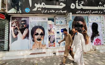 epa09421705 A view of the defaced posters of models on the walls of a beauty saloon in Kabul, Afghanistan, 20 August 2021. The Afghan interim council, formed to assist in the power transfer following President Ashraf Ghani's escape, has met several Taliban leaders to discuss issues related to control and security during the transition process. Fighting and violence have significantly reduced in Afghanistan with the surrender of the government troops and the resounding victory of the Taliban.  EPA/STRINGER