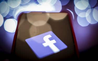The Facebook logo is seen on a mobile device screen in this photo illustration on January 31, 2019. (Photo by Jaap Arriens / Sipa USA)