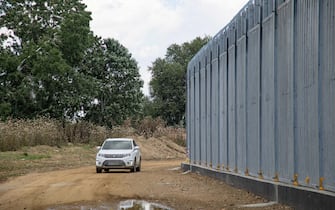 Greece is reinforcing the Greek Turkish borders with personnel, cameras, drones, heavy vehicles, FRONTEX officers but also with a 5 meter tall fence. The fence is actually a concrete filled, a construction for at least 40KM, a long coverage in the wetlands of Evros river (Meric in Turkish), Greece's river border with Turkey. EU is supporting the border fortification financially. Asylum seekers, migrants and refugees used Evros as an entrance point to Europe, while in March 2020 a huge wave of thousands of people tried to cross the borders. Poros Village, Evros region, Greece on June 18, 2021 (Photo by Nicolas Economou/NurPhoto via Getty Images)