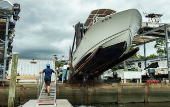 Boats are taken out of the water and placed on land by crews at Safe Harbor Marina in preparation for the impeding Tropical storm Henri expected to make landfall as a Hurricane on Sunday, in Buzzards Bay, Massachusetts on August 20, 2021. - A swath of the US east coast, including New York City, was under alert Friday due to approaching storm Henri, which is expected to become the first hurricane to hit the New England area in decades.
Forecasters warned of violent winds, the risk of flash floods and surging seas as the storm churned in the Atlantic, with landfall expected on Sunday. (Photo by JOSEPH PREZIOSO / AFP) (Photo by JOSEPH PREZIOSO/AFP via Getty Images)