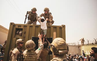 Twitter U.S. Marines - UK coalition forces, Turkish coalition forces, and U.S. #Marines assist a child during an evacuation at #HKIA, Kabul, Afghanistan, Aug. 20. U.S. service members are assisting the @StateDept with a non-combatant evacuation operation (NEO) in #Afghanistan.
