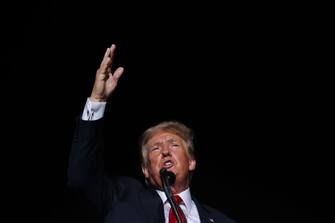 CULLMAN, ALABAMA - AUGUST 21: Former U.S. President Donald Trump addresses supporters during a "Save America" rally at York Family Farms on August 21, 2021 in Cullman, Alabama. With the number of coronavirus cases rising rapidly and no more ICU beds available in Alabama, the host city of Cullman declared a COVID-19-related state of emergency two days before the Trump rally. According to the Alabama Department of Public Health, 67.5% of the state's population has not been fully vaccinated. (Photo by Chip Somodevilla/Getty Images)