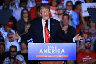 CULLMAN, ALABAMA - AUGUST 21: Former U.S. President Donald Trump addresses supporters during a "Save America" rally at York Family Farms on August 21, 2021 in Cullman, Alabama. With the number of coronavirus cases rising rapidly and no more ICU beds available in Alabama, the host city of Cullman declared a COVID-19-related state of emergency two days before the Trump rally. According to the Alabama Department of Public Health, 67.5% of the state's population has not been fully vaccinated. (Photo by Chip Somodevilla/Getty Images)