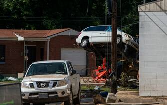Aug 22, 2021; Waverly, TN, USA; A fork lift carries a flood damaged car over debris during cleanup efforts on Sunday, Aug. 22, 2021, in Waverly, Tenn.  Mandatory Credit: Josie Norris-USA TODAY NETWORK /Sipa USA