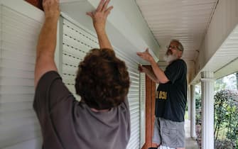 Clare and Joe Cermak work on putting the storm shutters up on their home as they prepare for the arrival of Hurricane Ida in St. Charles Parish, Louisiana, USA, 28 August 2021. The Parish is under a mandatory evacuation order as Hurricane Ida is expected to make landfall on the Louisiana coast Sunday 29 August evening as a major hurricane with the Mississippi and Louisiana coastal areas preparing for storms surges, wind damage and flooding. ANSA/DAN ANDERSON