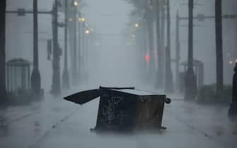 A dumpster tossed by gusting winds along Canal Street during Hurricane Ida in New Orleans, Louisiana, U.S., on Sunday, Aug. 29, 2021. Hurricane Ida barreled into the Louisiana coast on Sunday, packing winds more powerful than Hurricane Katrina and a devastating storm surge that threatens to inundate New Orleans with mass flooding, power outages and destruction. Photographer: Luke Sharrett/Bloomberg via Getty Images