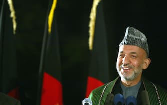 KABUL,AFGHANISTAN-NOVEMBER 4: Afghan President Hamid Karzai gives his victory speech at the Presidential palace November 4, 2004 in Kabul, Afghanistan after the Afghan election results were declared official yesterday. On October 9th, Afghans voted for the first time in a direct election but it tooks weeks to clarify the outcome due to questions of fraud. The election is seen as a crucial step towards democracy and peace in the war-torn country after the fall of the Taliban.
(photo by Paula Bronstein/Getty Images)