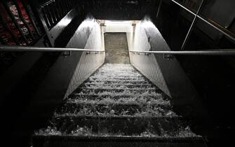 Flood waters cascade down subway steps as remnants of Hurricane Ida brings three inches of rain per hour across the city, in the New York City borough of Queens, NY, September 1, 2021. (Photo by Anthony Behar/Sipa USA)
