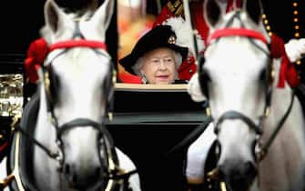 Queen Elizabeth II travels by carriage after of the Order of the Garter service at St George's Chapel, Windsor Castle.
