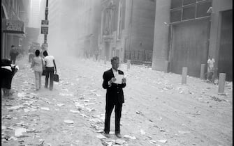 USA. NYC. 9/11/2001. A dazed man picks up a paper that was blown out of the towers after the attack of the World Trade Center, and begins to read it..

Contact email:
New York : photography@magnumphotos.com
Paris : magnum@magnumphotos.fr
London : magnum@magnumphotos.co.uk
Tokyo : tokyo@magnumphotos.co.jp

Contact phones:
New York : +1 212 929 6000
Paris: + 33 1 53 42 50 00
London: + 44 20 7490 1771
Tokyo: + 81 3 3219 0771

Image URL:
http://www.magnumphotos.com/Archive/C.aspx?VP3=ViewBox_VPage&IID=2K7O3RK4HAB&CT=Image&IT=ZoomImage01_VForm