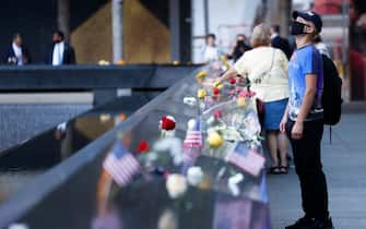 epa09461056 People visit the 9/11 Memorial on the 20th anniversary of the September 11 attacks in Manhattan, New York City, U.S., September 11, 2021.  EPA/MIKE SEGAR / POOL