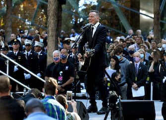 NEW YORK, NEW YORK - SEPTEMBER 11: Bruce Springsteen performs at the National 9/11 Memorial and Museum ceremony commemorating the 20th anniversary of the 9/11 attacks on the World Trade Center on September 11, 2021 in New York City. The nation is marking the 20th anniversary of the terror attacks of September 11, 2001, when the terrorist group al-Qaeda flew hijacked airplanes into the World Trade Center, Shanksville, PA and the Pentagon, killing nearly 3,000 people. (Photo by Ed Jones-Pool/Getty Images)