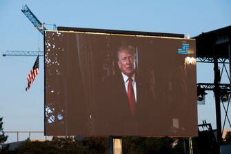 WASHINGTON, DC - SEPTEMBER 11: A screen displays a video message from former U.S. President Donald Trump plays during a "Let Us Worship" prayer service on the National Mall on September 11, 2021 in Washington, DC. The nation is marking the 20th anniversary of the terror attacks of September 11, 2001, when the terrorist group al-Qaeda flew hijacked airplanes into the World Trade Center, Shanksville, PA and the Pentagon, killing nearly 3,000 people.  (Photo by Anna Moneymaker/Getty Images)