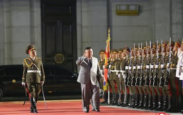 epa08734533 A photo released by the official North Korean Central News Agency (KCNA) shows North Korean leader Kim Jong-un (R) inspecting guards during a military parade on the occasion of the 75th founding anniversary of the Workers' Party of Korea, at Kim Il Sung Square in Pyongyang, North Korea, 10 October 2020.  EPA/KCNA