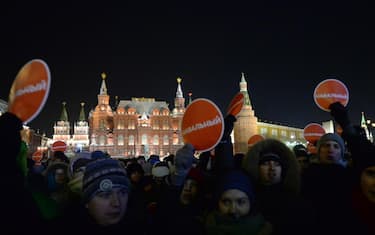 (141230) -- MOSCOW, Dec. 30, 2014 (Xinhua) -- Alexei Navalny's supporters gather at Manezhnaya Square in Moscow, Russia, on Dec. 30, 2014. Russian activists gather at Manezhnaya square in Moscow after the verdict for Navalny brothers. Opposition leader Alexei Navalny got a 3.5-year suspended sentence and his brother Oleg was ordered to serve a 3.5-year prison term. They have been found guilty of embezzlement from French cosmetics company Yves Rocher. (Xinhua/Pavel Bednyakov)