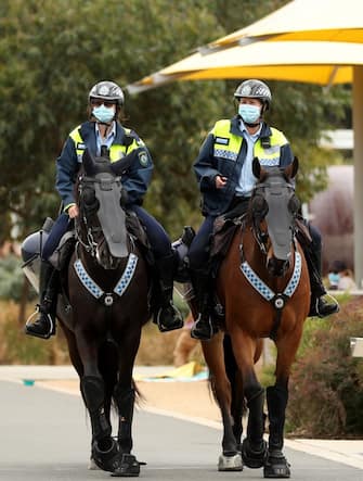 SYDNEY, AUSTRALIA - SEPTEMBER 18: N.S.W Mounted Police patrol Sydney Park on September 18, 2021 in Sydney, Australia. Anti-lockdown protesters gathered despite current COVID-19 restrictions prohibiting large outdoor gatherings. Greater Sydney is currently subject to lockdown restrictions as health authorities work to contain the spread of the highly contagious Delta COVID-19 variant, with people only permitted to leave their homes for essential reasons, or to gather in groups of five outdoors if all parties are fully vaccinated. (Photo by Brendon Thorne/Getty Images)