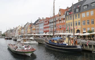 COPENHAGEN, DENMARK - JUNE 20, 2021: Boats on a canal in Nyhavn, a waterfront district of Copenhagen, in summer. Grigory Dukor/TASS (Photo by Grigory Dukor\TASS via Getty Images)