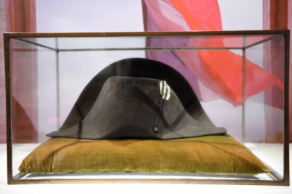1341819673 PARIS, FRANCE - SEPTEMBER 21: One of Napoleon Bonaparte's famous black-felt bicorne hats is on display during an online auction titled 'Influencing the Arts: Napoleon', marking the 200th anniversary of Napoleon's death, at Sotheby's Paris on September 21, 2021 in Paris, France. (Photo by Li Yang/China News Service via Getty Images)