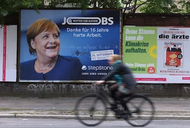 BERLIN, GERMANY - SEPTEMBER 19: A billboard advertising for a jobs recruiting firm shows German Chancellor Angela Merkel and reads: "Thanks for 16 years of hard work" next to a smaller election poster for the German Greens Party ahead of federal parliamentary elections on September 19, 2021 in Berlin, Germany. Merkel will make way for a successor following elections scheduled for September 26. (Photo by Sean Gallup/Getty Images)