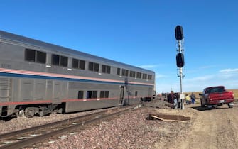 epa09488874 A view of a derailed Amtrak train, outside of Joplin, Montana, USA, 25 September 2021. According to a statement from Amtrak, the train was en route to Seattle after departing from Chicago, with 146 passengers and 16 crew members onboard. According to the Liberty County Sheriff's Department, three people died in the accident. The cause of the accident is not known at this time.  EPA/Jacob Cordeiro   EDITORIAL USE ONLY/NO SALES