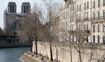 People enjoy the sunny weather along the Canal Saint-Martin despite the Coronavirus Pandemic in Paris, France, on March 31, 2021. Critical care doctors in Paris say surging coronavirus infections could soon overwhelm their ability to care for the sick in the French capitalâÂ&#x80;Â&#x99;s hospitals, possibly forcing them to choose which patients they have the resources to save. President Macron is expected to give a TV speech on Wednesday detailing possible new restrictions to fight Covid-19. Photo by Aurore Marechal/ABACAPRESS.COM