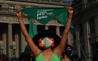 LIMA, PERU - 2021/09/28: A girl waving a green scarf as dozens of women, wearing green scarves, carry out a demonstration in front of the Peruvian Judiciary Palace demanding the legalization of abortion. Abortion in Peru, a conservative country, is illegal and punishable. (Photo by Carlos Garcia Granthon/Fotoholica Press/LightRocket via Getty Images)