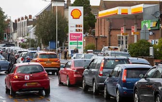 As the fuel crisis in the UK continues, this Shell petrol station is open for business as usual, motorists arrive in with their cars to fill up with fuel on the 1st of October 2021 in Folkestone, United Kingdom. Almost all the petrol stations in Folkestone have no fuel, this Shell garage took a delivery recently and now has queues over half a mile in both directions. People have been waiting for more than 2 hours to get fuel. Panic buying and long queues outside some petrol stations as the crisis, which has been caused by a lack of HGV drivers available to deliver supplies, continues. (photo by Andrew Aitchison / In pictures via Getty Images)