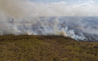 epa08604331 Aerial view of a forest fire near the city of Cuiaba, in the state of Mato Grosso, Brazil, 14 August 2020. The Brazilian Amazon, which is home to the largest tropical forest in the world, is on its way to close 2020 with a record of devastated area, after the so-called 'deforestation alerts' have grown by 33% in the year-on-year period that ended last July. The Brazilian Pantanal, a biodiversity sanctuary located in the southern Amazon, faces similar threats.  EPA/ROGERIO FLORENTINO