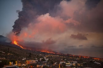 LA PALMA, SPAIN - OCTOBER 05: Lava coming from the Cumbre Vieja volcano burns fields around the building in Los Llanos in the Canary island of La Palma in El Paso, Spain on October 05, 2021. (Photo by Marcos Moreno/Anadolu Agency via Getty Images)