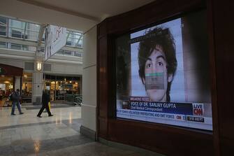 BOSTON, MA - APRIL 23:  A photograph of suspect Dzhkokhar Tsarnaev is played on a television in a shopping center near the site of the Boston Marathon bombings on April 23, 2013 in Boston, Massachusetts. Business owners and residents of the closed section were allowed to return to their properties today while under escort of city staff.  (Photo by Mario Tama/Getty Images)