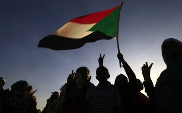 TOPSHOT - Sudanese women march in Khartoum to mark International Day for Eliminating Violence against Women, in the first such rally held in the northeast African country in decades, on November 25, 2019. - Chanting "Freedom, peace, justice," the catchcry of the protest movement that led to autocrat Omar al-Bashir's ouster in April, the demonstrators took to the streets in the Burri district, a site of regular anti-Bashir protests earlier this year. (Photo by Ashraf SHAZLY / AFP) (Photo by ASHRAF SHAZLY/AFP via Getty Images)