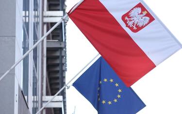 A picture taken on October 8, 2021 shows the polish flag and EU flag at the entrance of Polish embassy in Brussels. - Poland's Prime Minister on October 8 said that Poland wanted to stay in the European Union, a day after a landmark court ruling that experts said could instead lead to "Polexit". (Photo by Kenzo Tribouillard / AFP) (Photo by KENZO TRIBOUILLARD/Afp/AFP via Getty Images)