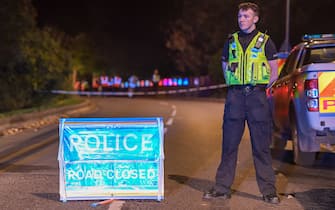 SALISBURY, ENGLAND - OCTOBER 31: Police at a road block near the train collision involving a South Western Railway train and a Great Western train on October 31, 2021 in Salisbury, England. The incident occurred when a Bristol-bound train struck an object in the Fisherton Tunnel and derailed, and was then struck by a Honiton-bound train. (Photo by Finnbarr Webster/Getty Images)
