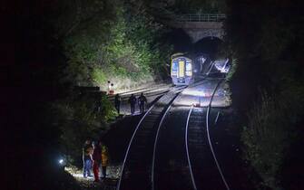 SALISBURY, ENGLAND - NOVEMBER 01: Police at the scene of the train collision on November 1, 2021 in Salisbury, England. The incident occurred when a Bristol-bound train struck an object in the Fisherton Tunnel and derailed, and was then struck by a Honiton-bound train. (Photo by Finnbarr Webster/Getty Images)