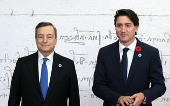ITALY G20 ROME SUMMIT epa09553595 Italian Prime Minister Mario Draghi (L) welcomes Canadian Prime Minister Justin Trudeau as he arrives for the G20 Leaders' Summit at La Nuvola Congress Centre in Rome, Italy, 30 October 2021. The Group of Twenty (G20) Heads of State and Government Summit will be held in Rome on 30 and 31 October 2021. EPA/ETTORE FERRARI / POOL