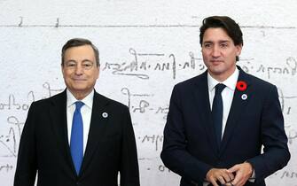 epa09553595 Italian Prime Minister Mario Draghi (L) welcomes Canadian Prime Minister Justin Trudeau as he arrives for the G20 Leaders' Summit at La Nuvola Congress Centre in Rome, Italy, 30 October 2021. The Group of Twenty (G20) Heads of State and Government Summit will be held in Rome on 30 and 31 October 2021.  EPA/ETTORE FERRARI / POOL