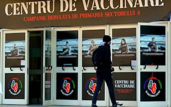 epa09552134 A Romanian young man approaches the entrance to a Covid-19 Marathon Vaccination For Life II organized at Children Palace venue in Bucharest, Romania, 29 October 2021. The 'Vaccination Marathon for Life', an event where people can get vaccinated against Covid-19 without an appointment, is meant to promote the benefits and importance of vaccination against COVID-19, including for pregnant women, as Romania is troubled by one of the worst coronavirus waves in Europe since 2019. Starting on 22 October, six vaccination centers are opened non-stop during the weekend in Bucharest, offering vaccination flows with four different types of vaccine. The daily infection rate was announced to have decreased on 29 October, at about 12,000 from a maximum of 16,000 recorded last week. The first edition of the Vaccination Marathon for Life was considered by the organizers a success.  EPA/ROBERT GHEMENT