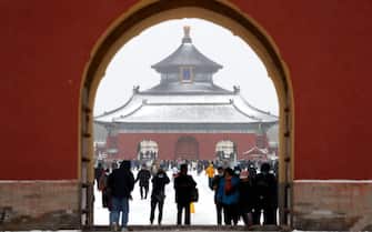 BEIJING, CHINA - NOVEMBER 07: People enjoy snow scenery at Temple of Heaven (Tiantan) Park on November 7, 2021 in Beijing, China. (Photo by Fu Tian/China News Service via Getty Images)
