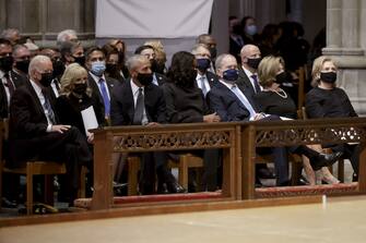 U.S. President Joe Biden, from left, First Lady Jill Biden, former U.S. President Barack Obama, former First Lady Michelle Obama, former U.S. President George W. Bush, former First Lady Laura Bush and Hillary Clinton, former U.S. secretary of state, attend the funeral for Colin Powell, former secretary of state, at Washington National Cathedral in Washington, D.C., U.S., on Friday, Nov. 5, 2021. Powell, who was born in Harlem to Jamaican immigrants and rose to become the U.S.'s first Black secretary of state and chairman of the Joint Chiefs of Staff, died at 84 due to complications from Covid-19. Photographer: Samuel Corum/Bloomberg via Getty Images