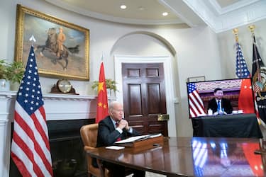 epa09584543 US President Joe Biden listens during a virtual summit with Chinese President Xi Jinping in the Roosevelt Room of the White House in Washington DC, USA, 15 November 2021.  EPA/SARAH SILBIGER / POOL